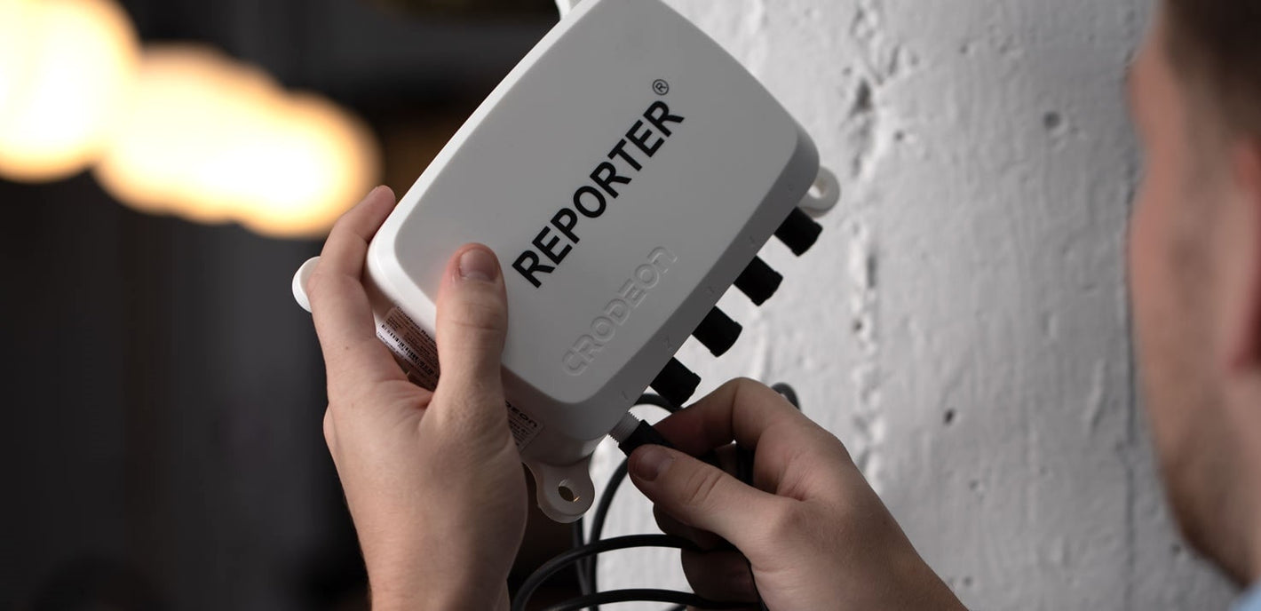 Someone plugging a sensor into one of Reporter's connectors